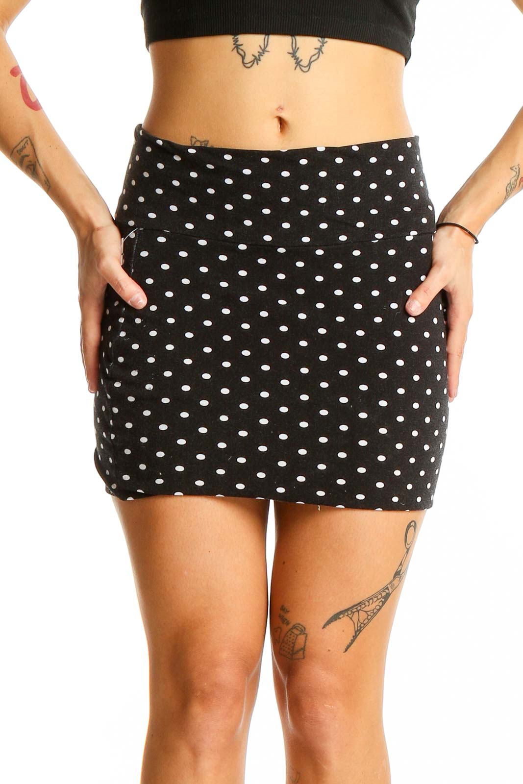 Front view of Lily White black and white polka dot mini skirt