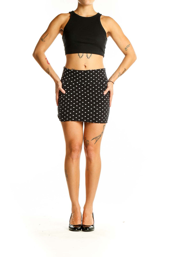 Front view of Lily White black and white polka dot mini skirt