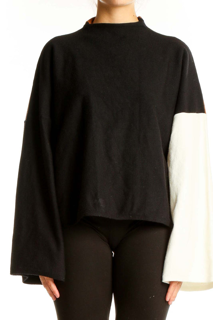 Front view of Modern Citizen black and white color block knit sweater with mock neck