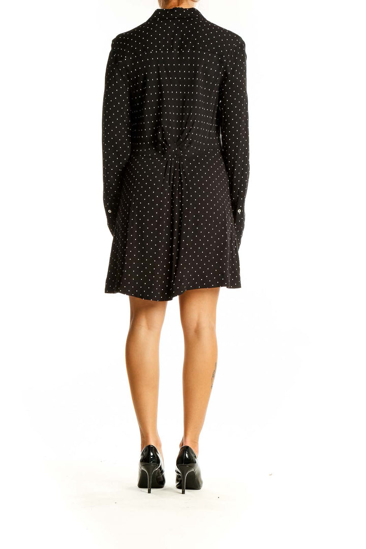 Back view of Free People black polka dot button-down shirt dress