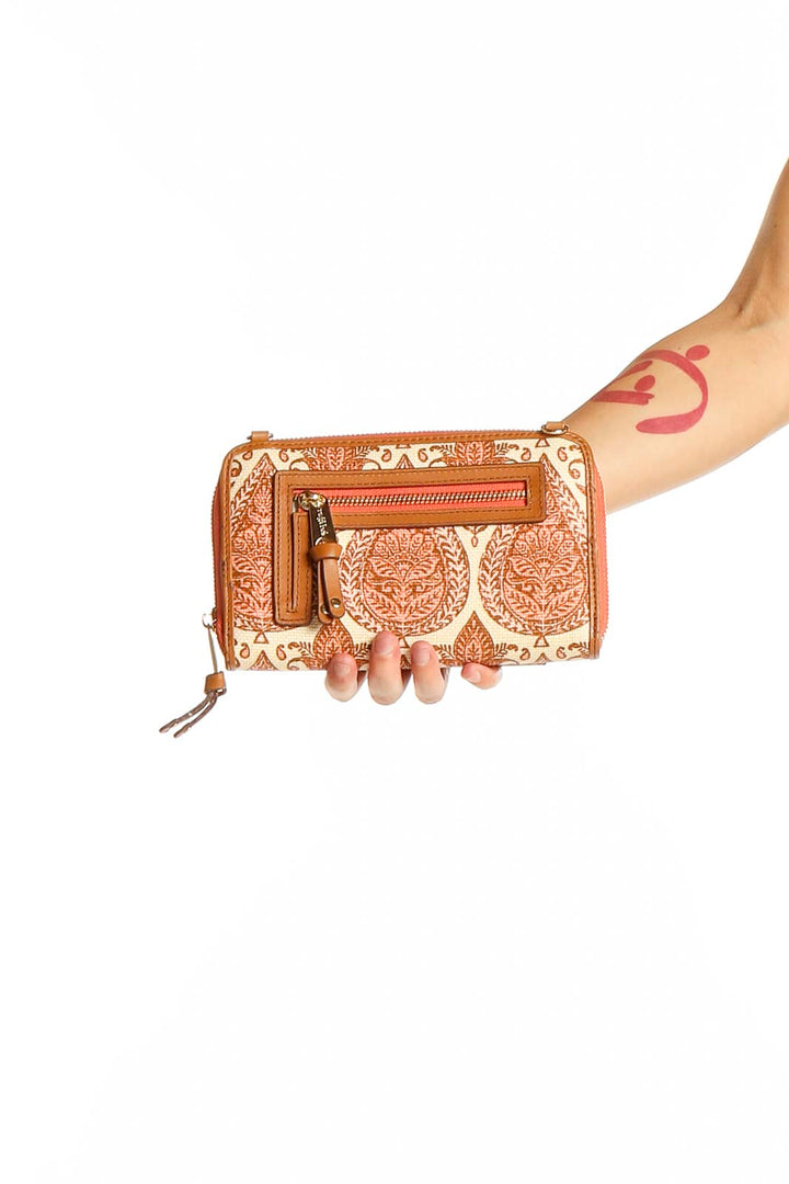 Front view of tan floral embossed leather clutch by Spartina 449