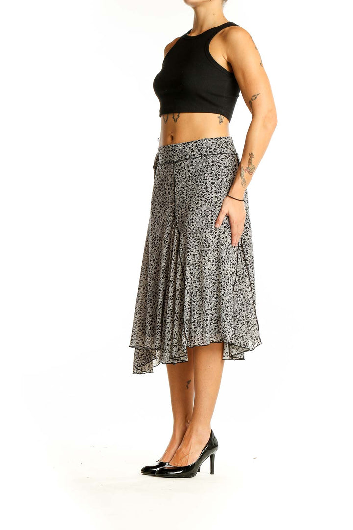 Front view of Max Studio black and white floral print midi skirt on model