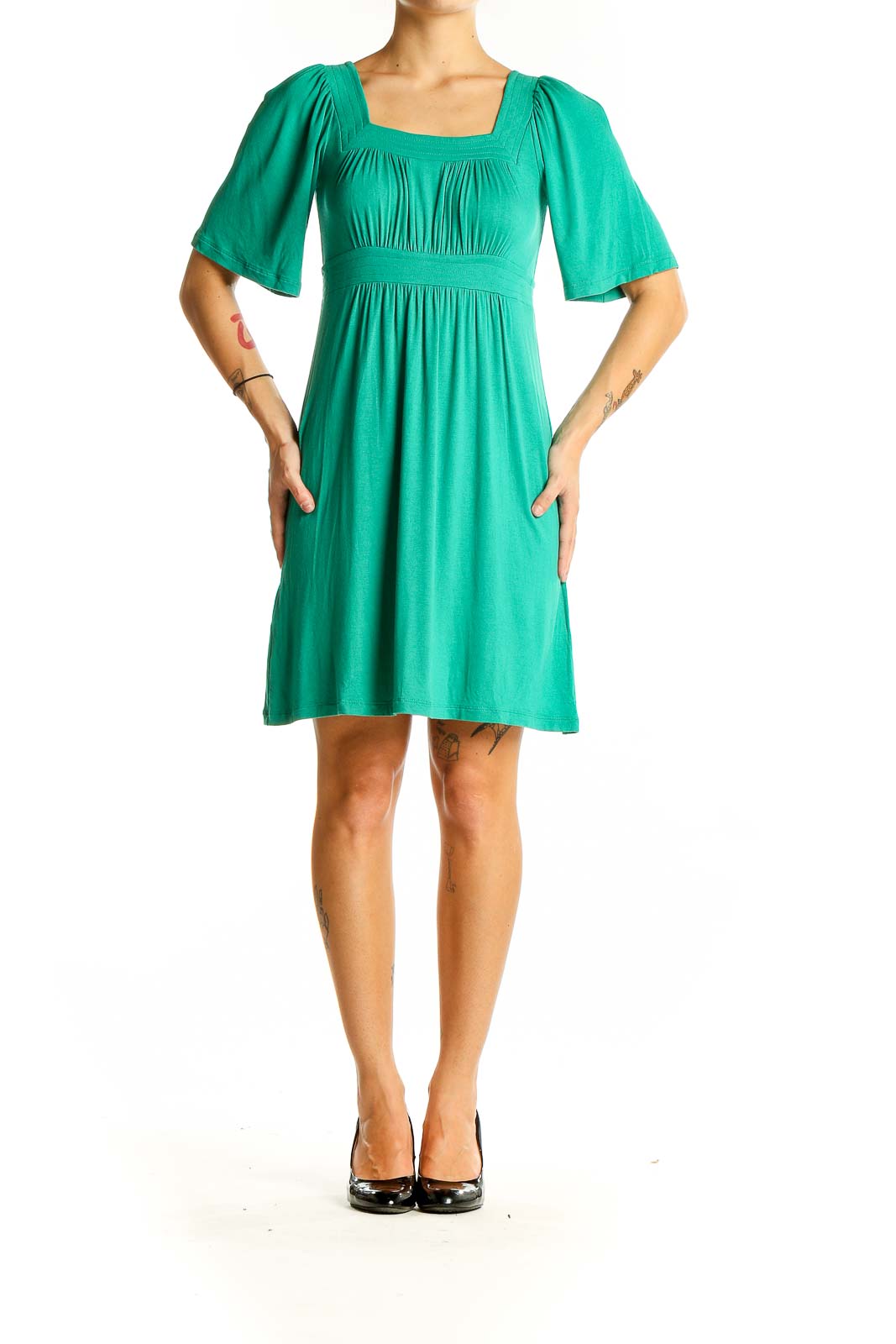 Front view of green BCBG MaxAzria dress with square neckline and empire waist