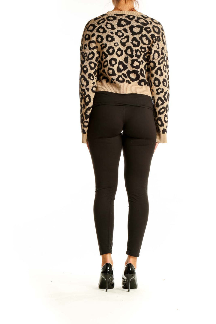 Back view of BCBGeneration tan leopard print cropped sweater on model