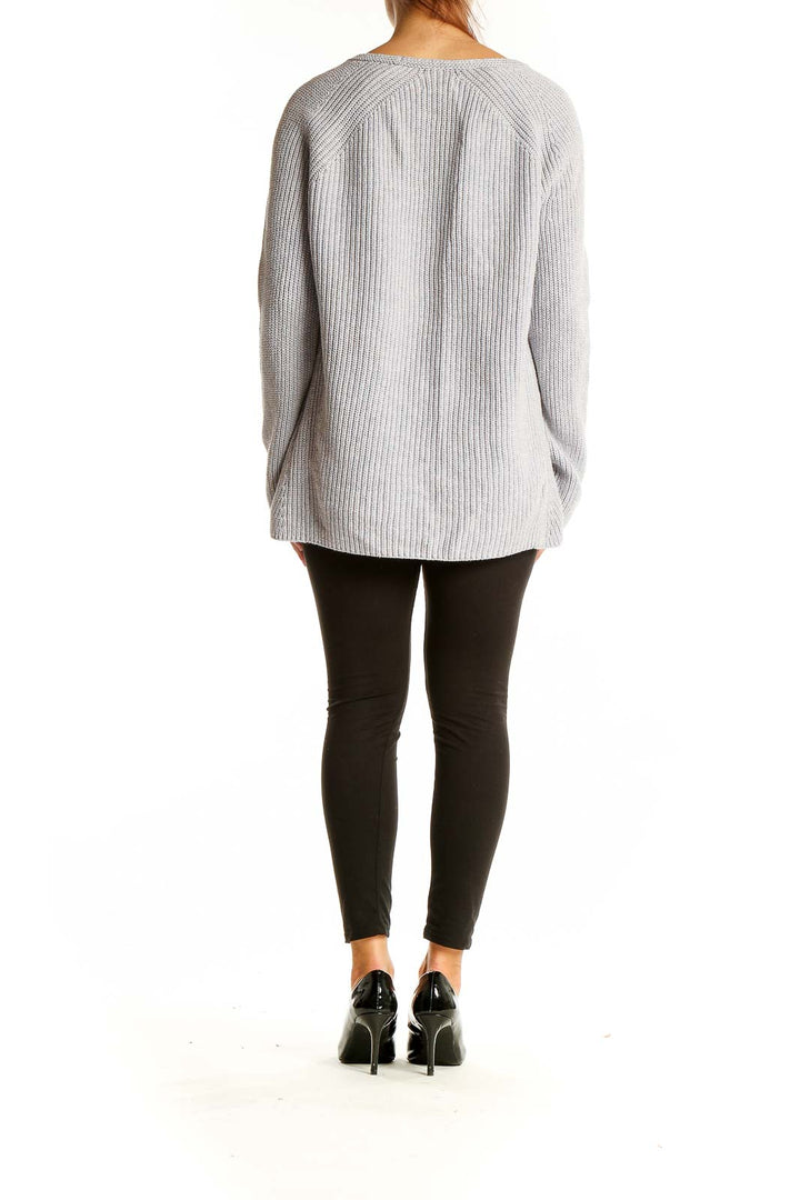 Back view of Lou & Grey gray ribbed V-neck sweater on model with black leggings