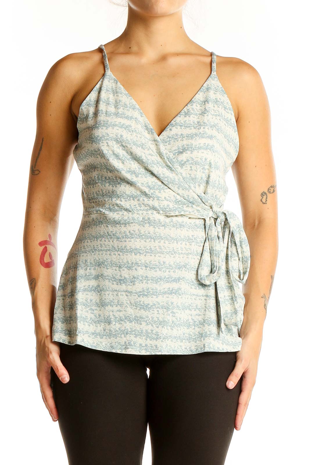 Front view of Gilli light blue striped wrap camisole top with V-neckline and side tie