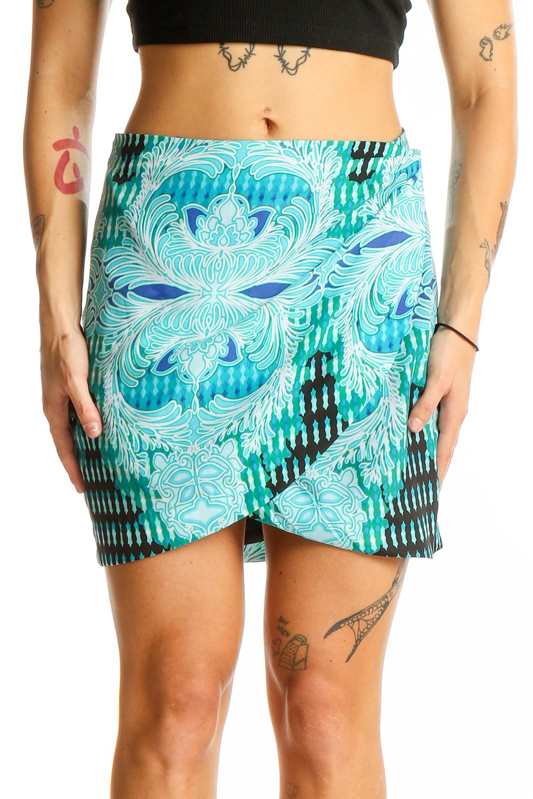 Front view of Bebe turquoise floral print wrap mini skirt