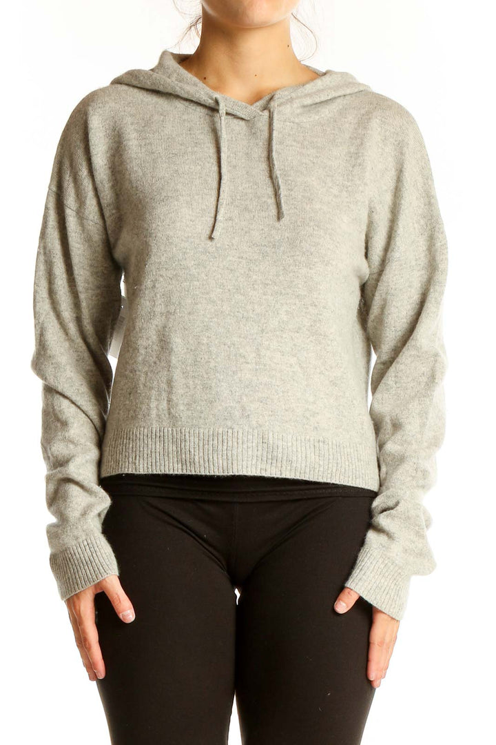 Front view of gray cropped hooded knit sweater from Reformation Jeans