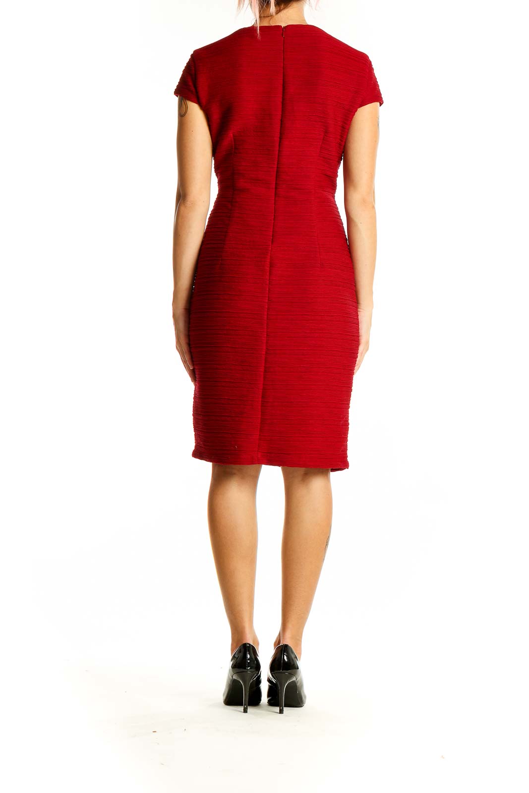 Back view of red textured bodycon midi dress by Taylor showing zipper closure