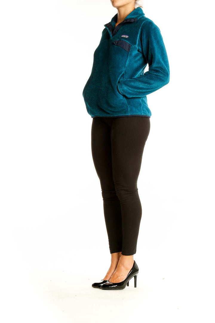 Front view of teal Patagonia fleece pullover jacket with quarter-zip design