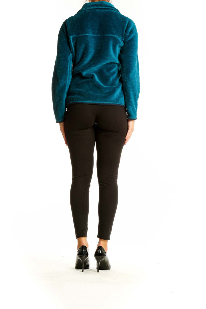 Back view of teal Patagonia fleece pullover jacket showing full length