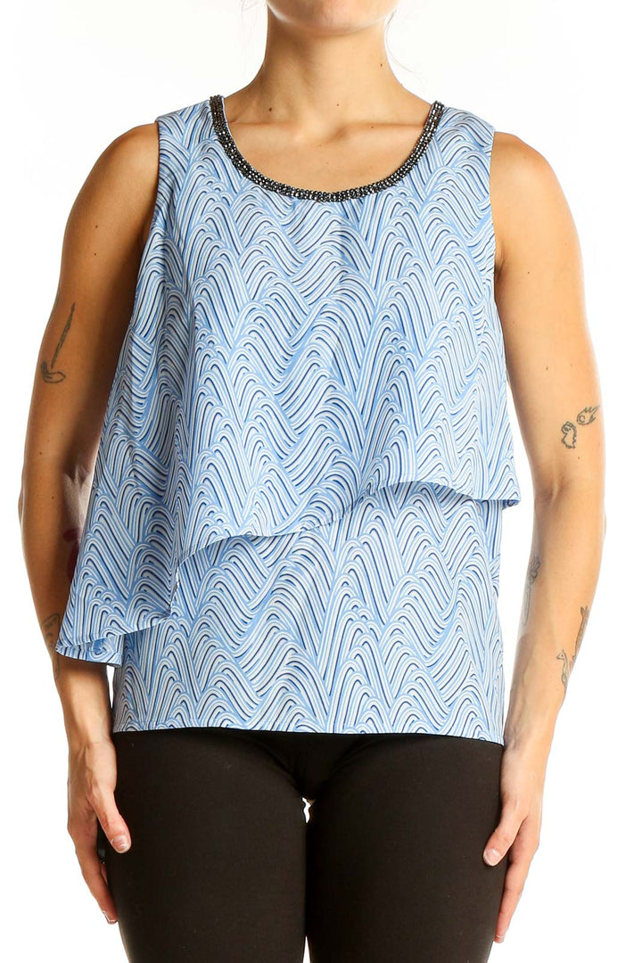 Front view of Juicy Couture light blue sleeveless top with wave pattern and layered design