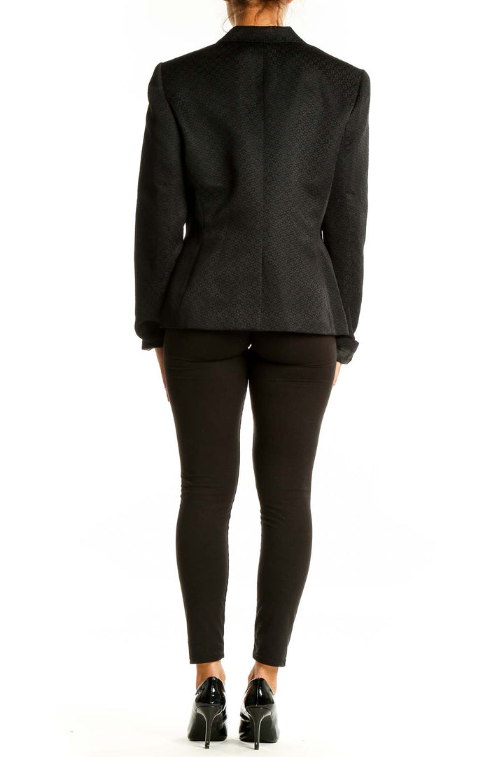 Back view of Evan Picone black textured polyester blazer showing tailored fit