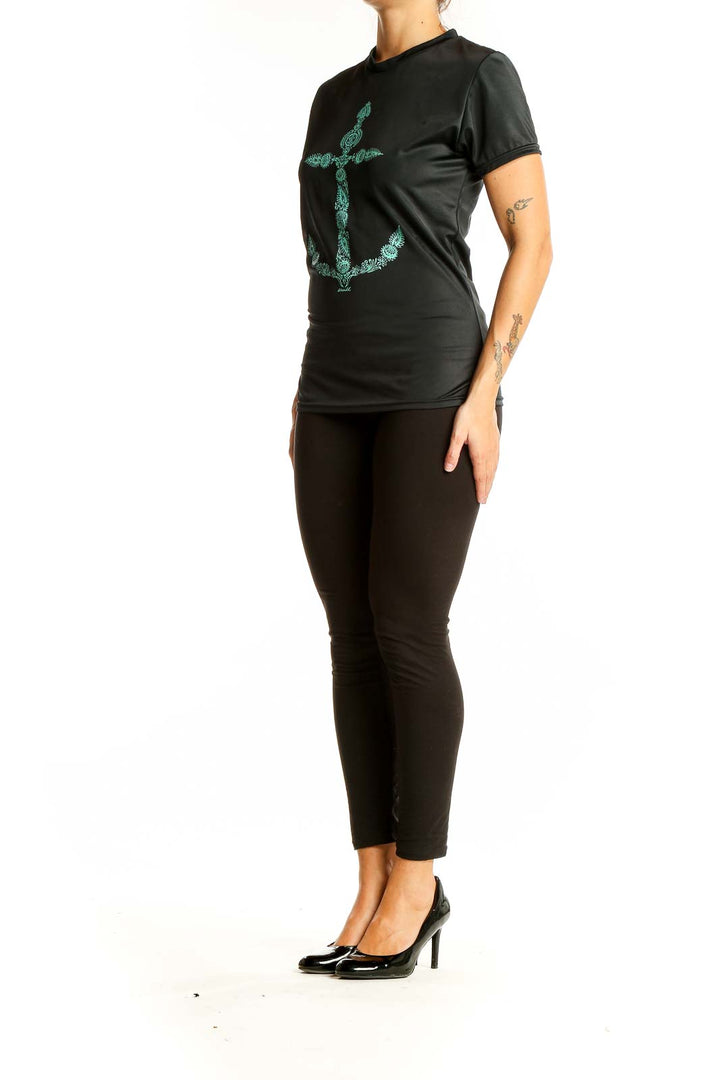 Front view of black O'Neill performance t-shirt with teal anchor print