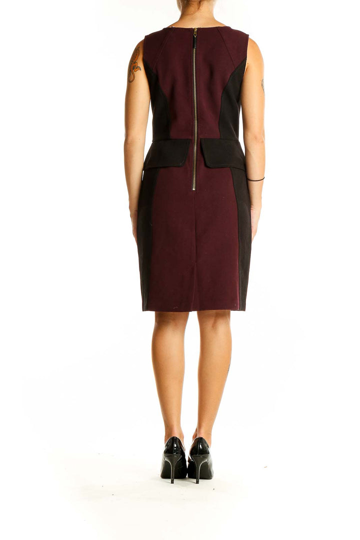 Back view of LOFT burgundy and black color block sheath dress with zipper closure