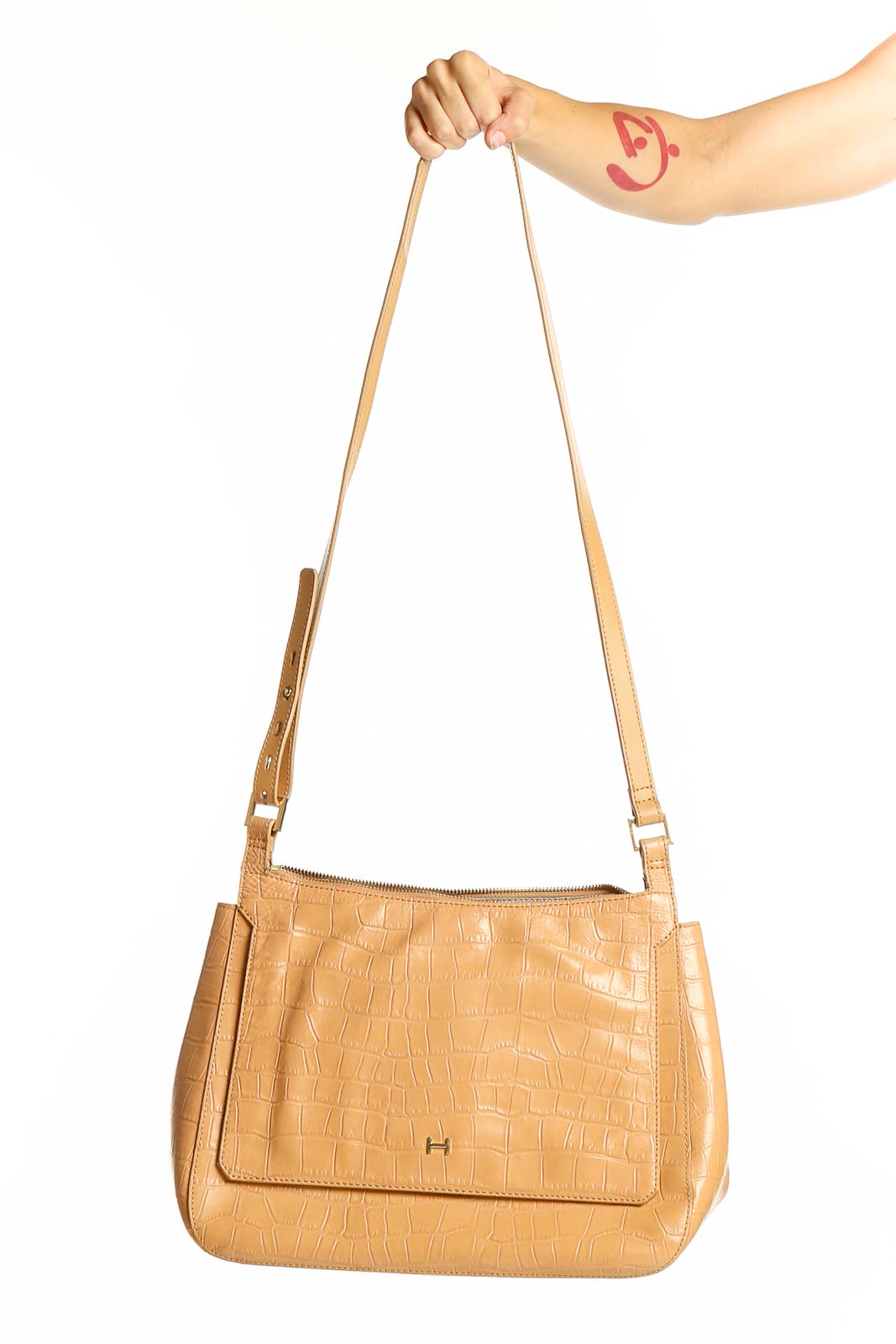 Front view of tan croc-embossed leather crossbody bag by H by Halston