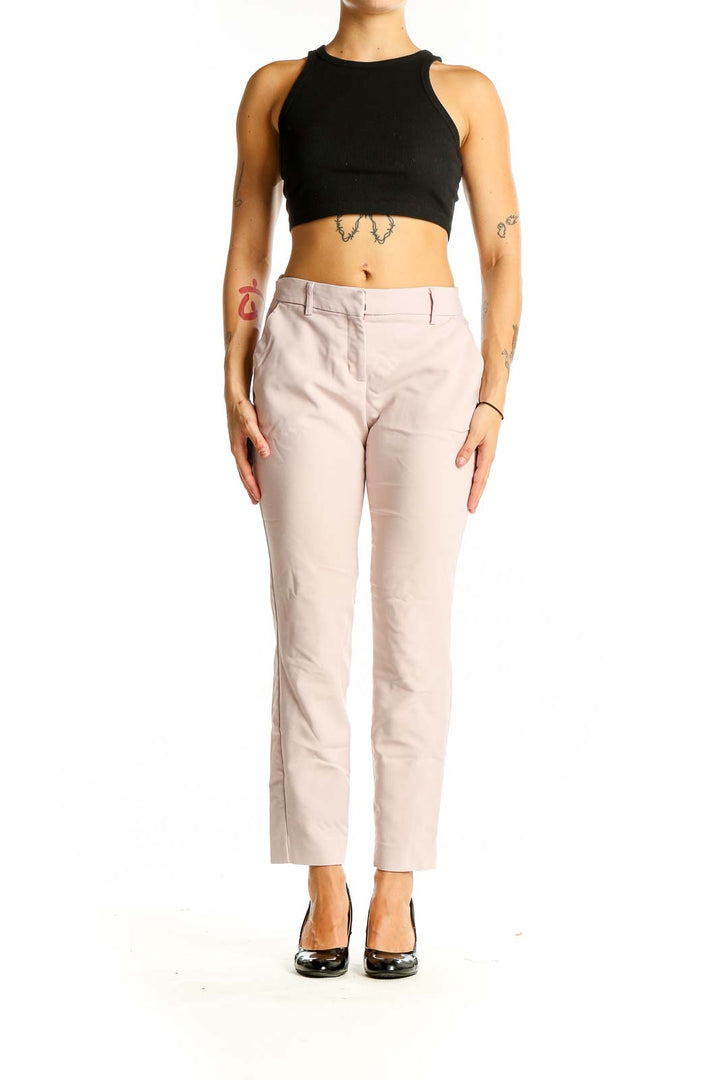 Front view of Express blush slim fit ankle pants on model