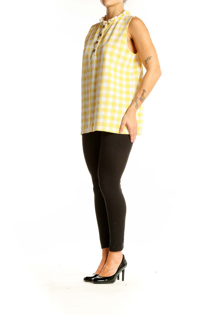 Front view of Ann Taylor yellow gingham sleeveless top with ruffle collar