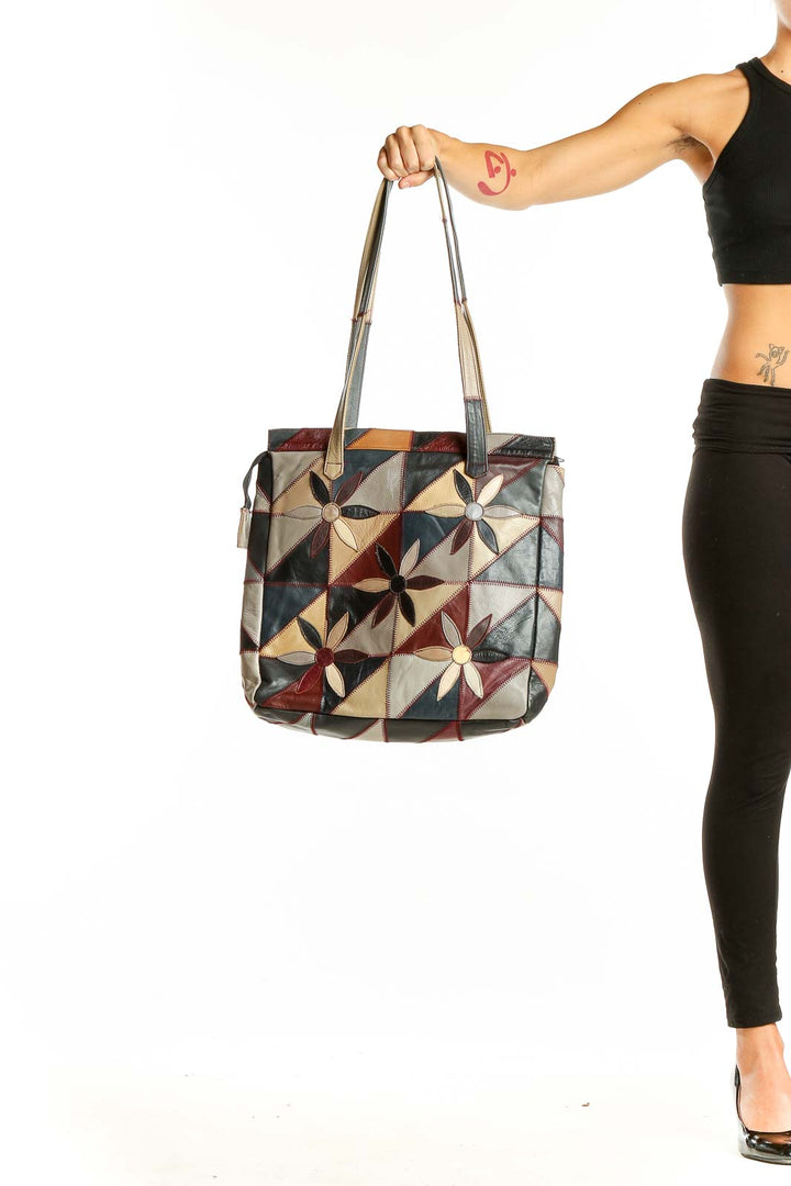 Front view of SilkRoll multicolor patchwork leather tote bag with geometric flower design