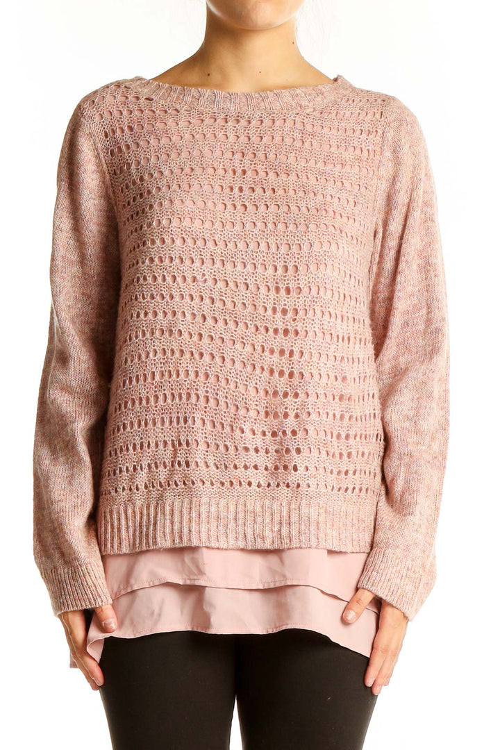 Front view of pink layered knit sweater with open-knit design