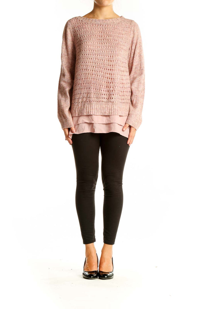 Front view of pink layered knit sweater with open-knit design