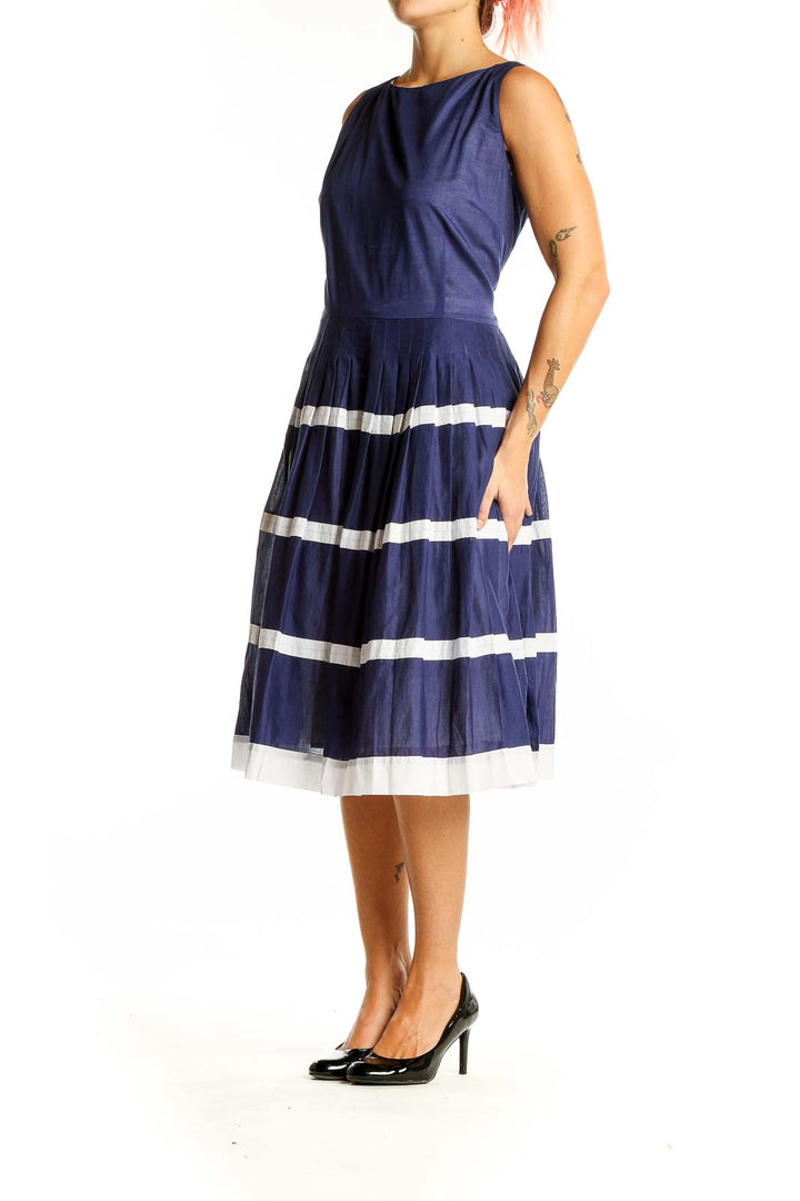 Front view of navy Talbots cotton dress with white striped pleated skirt