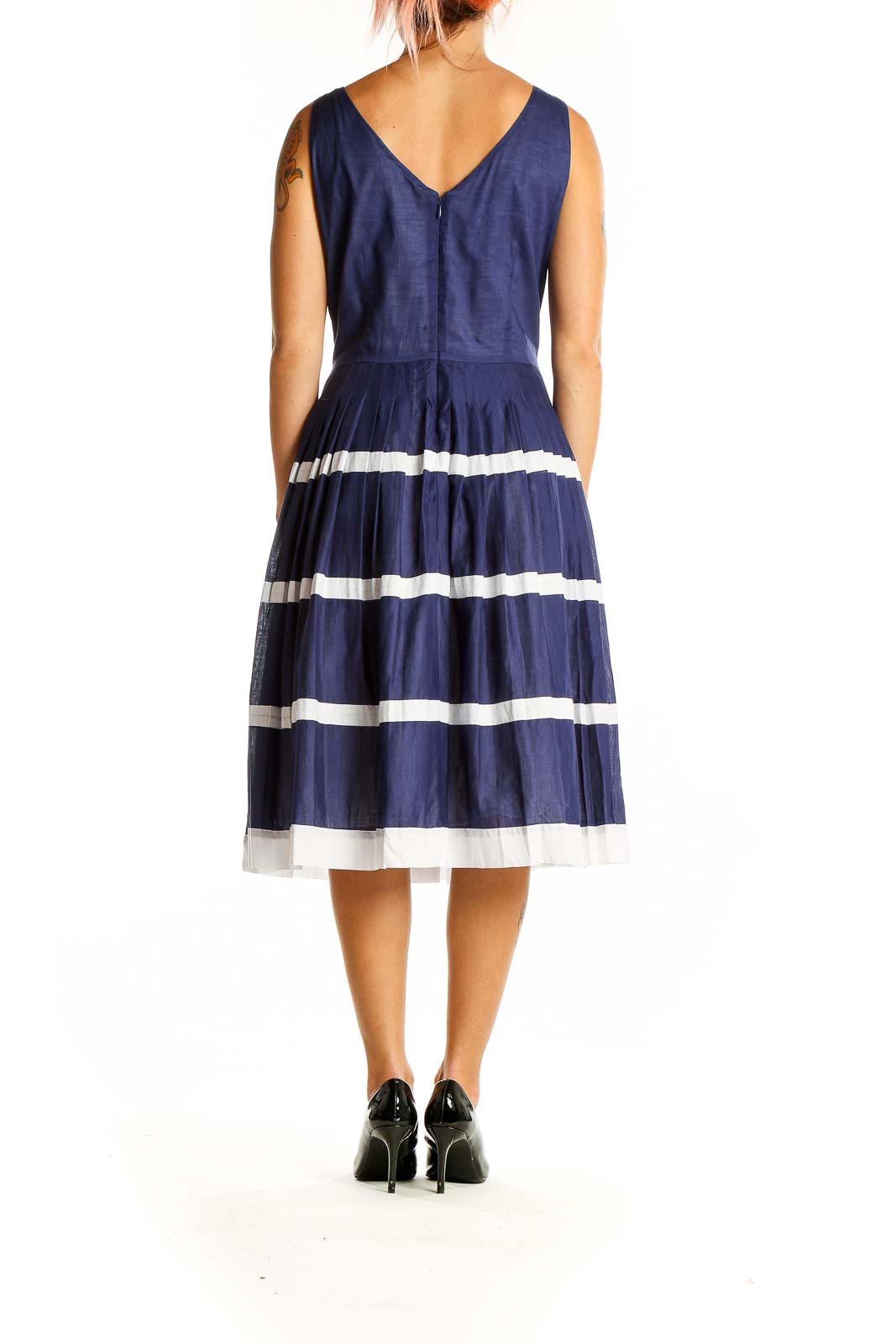 Back view of navy Talbots cotton dress showing V-neckline and pleated skirt with white stripes