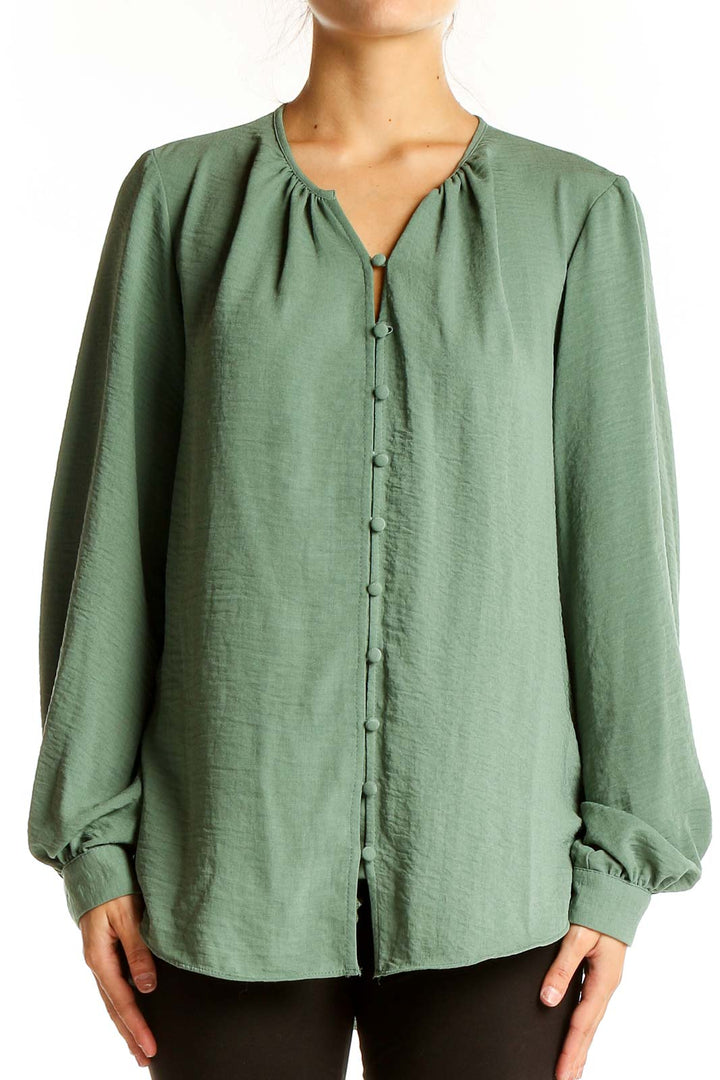 Front view of Nine West sage green button-front blouse with balloon sleeves