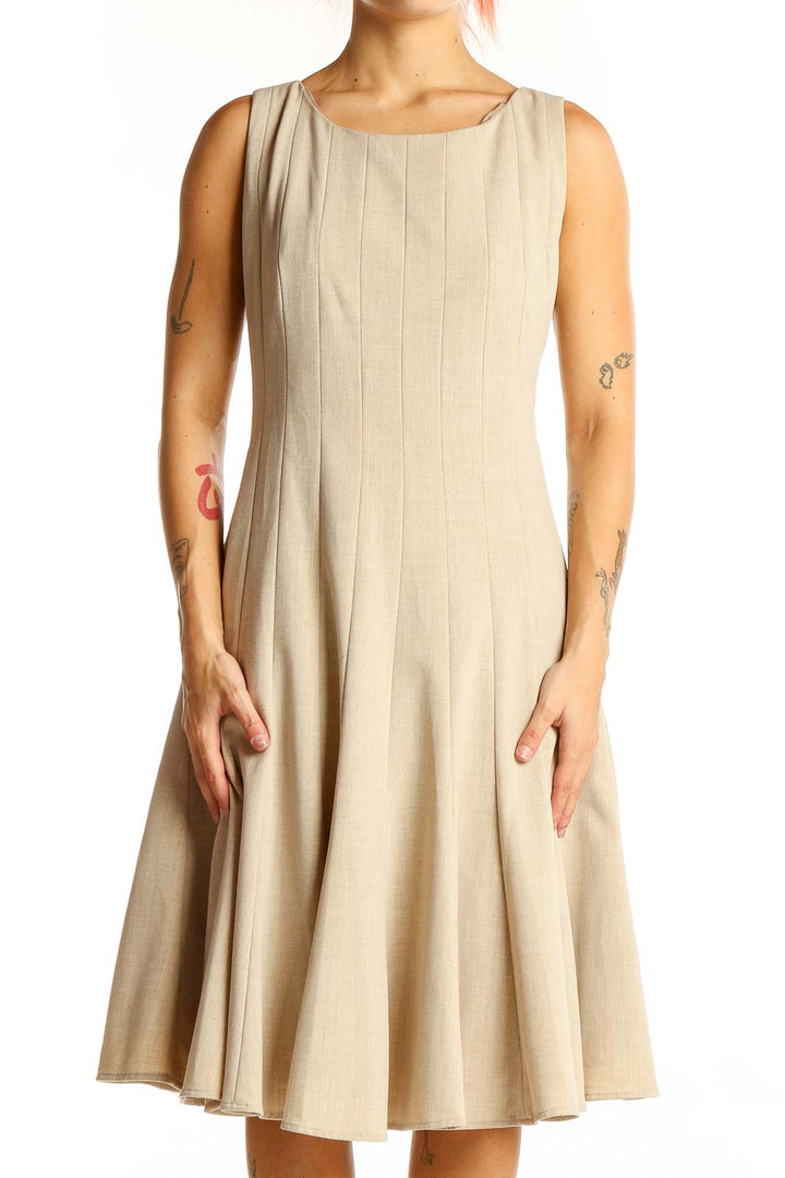 Front view of beige Calvin Klein pleated sleeveless A-line dress