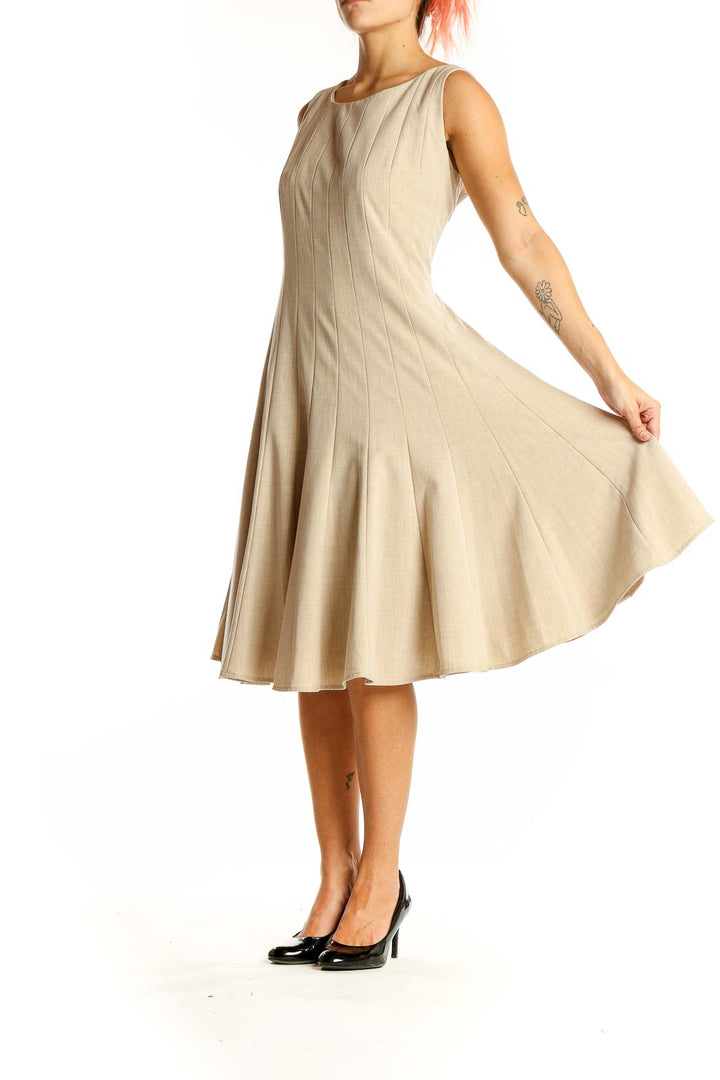 Front view of beige Calvin Klein pleated sleeveless A-line dress