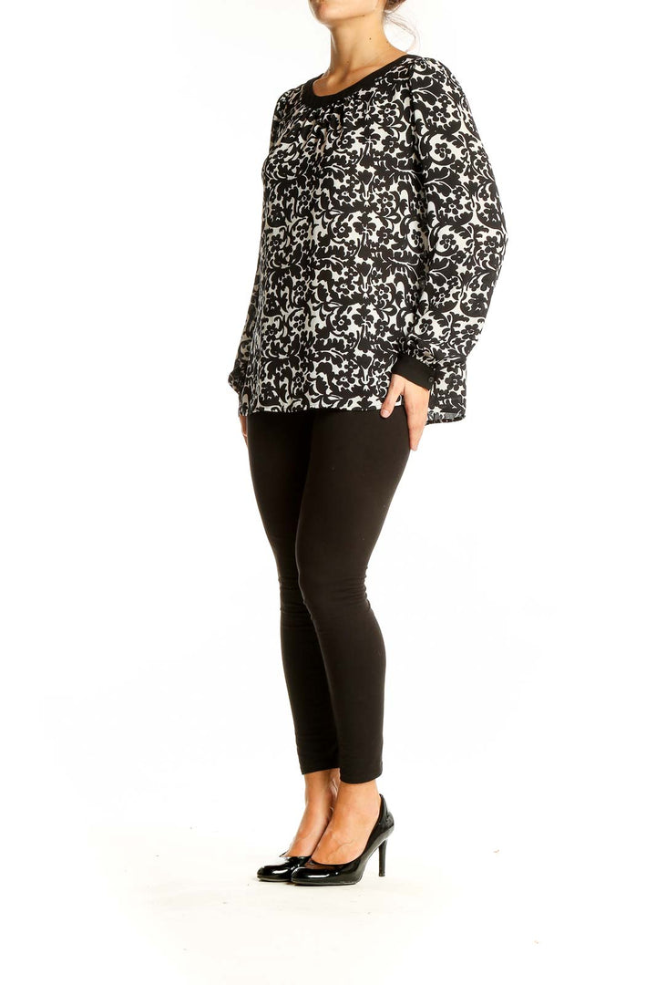 Front view of Ann Taylor LOFT black and white floral print blouse with scoop neckline