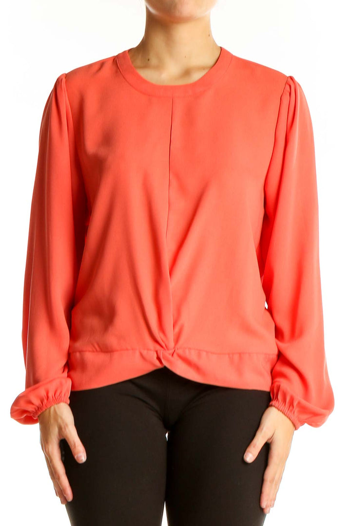 Front view of coral twist-front long sleeve blouse by Nine West