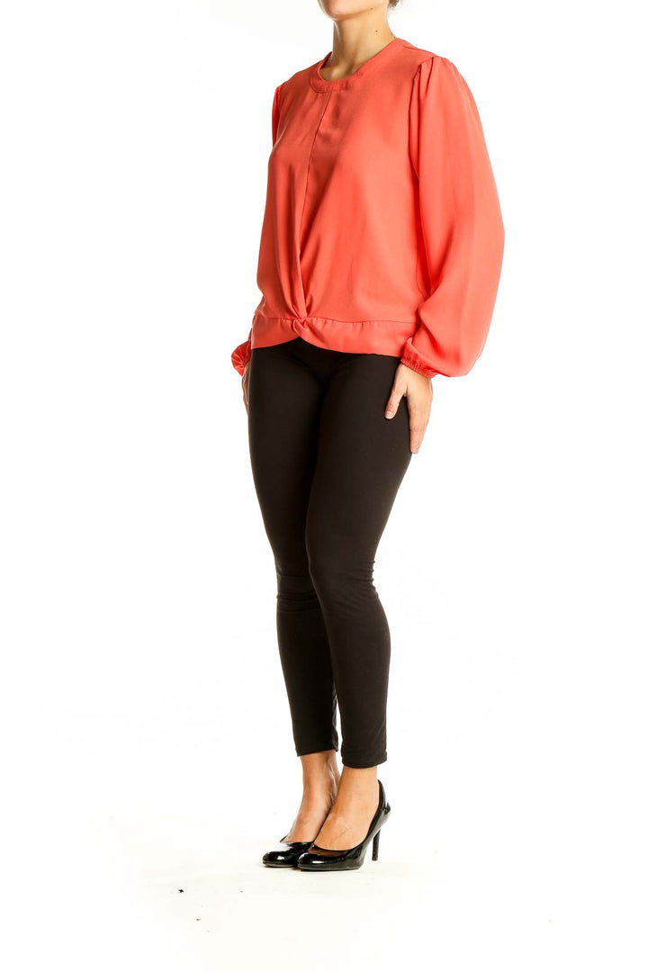 Front view of coral twist-front long sleeve blouse by Nine West