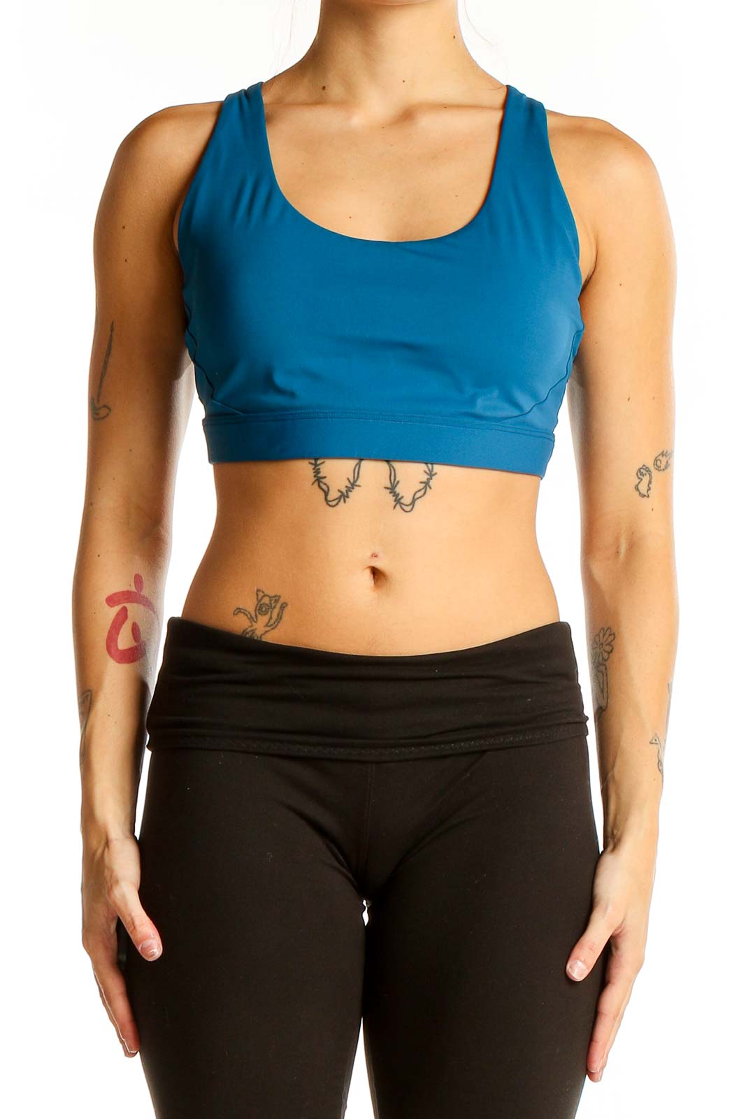 Front view of blue Athleta racerback crop top on model