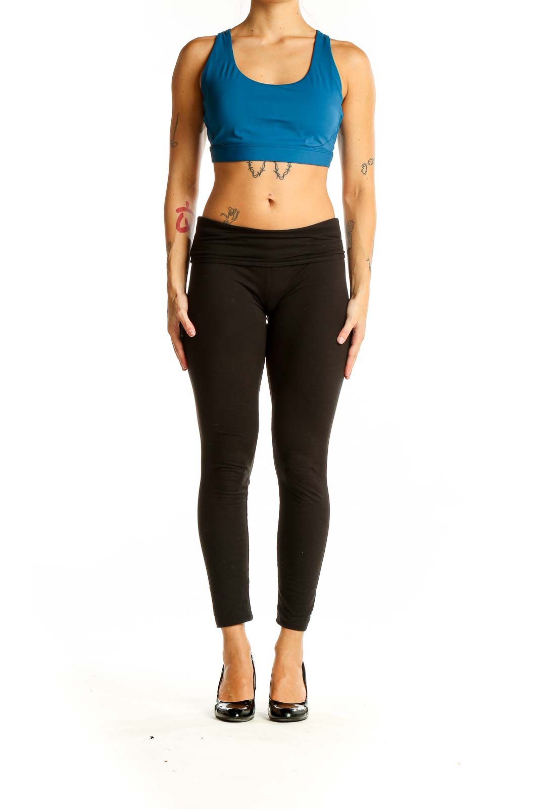 Front view of blue Athleta racerback crop top on model