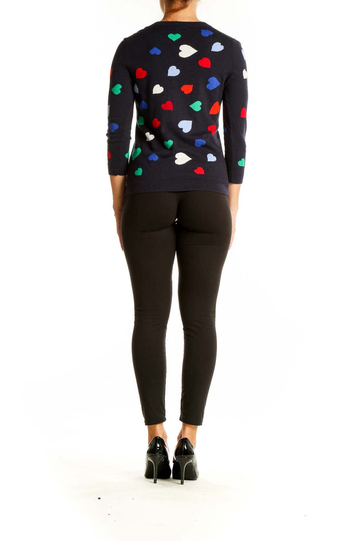 Back view of Talbots black knit sweater showing all-over heart print pattern