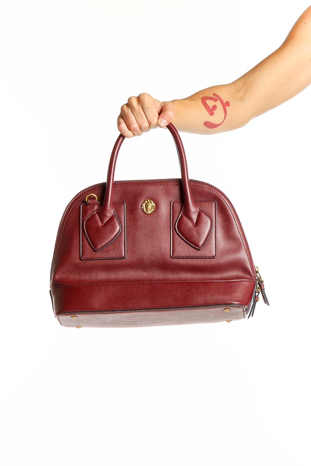 Front view of Anne Klein burgundy leather dome satchel with gold-tone hardware