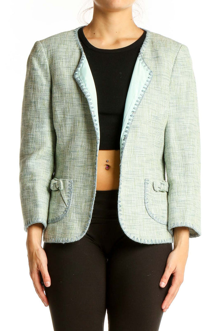 Front view of mint green Ann Taylor blazer with textured fabric and open front design