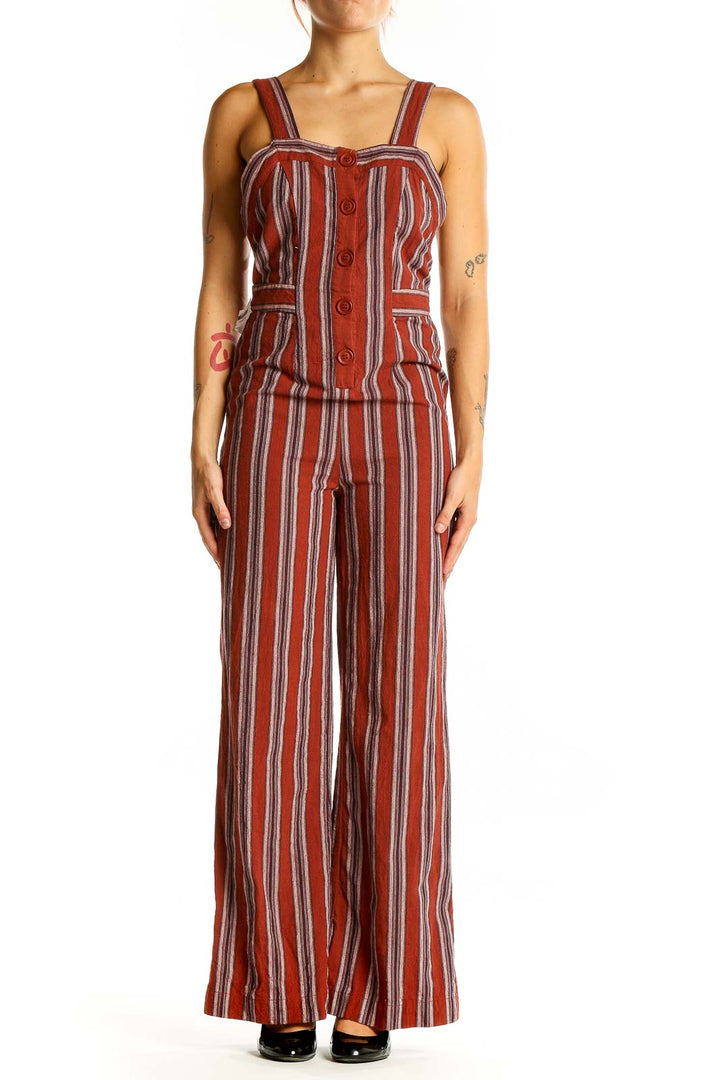 Front view of Audrey 3+1 rust striped linen-rayon jumpsuit with button-front design