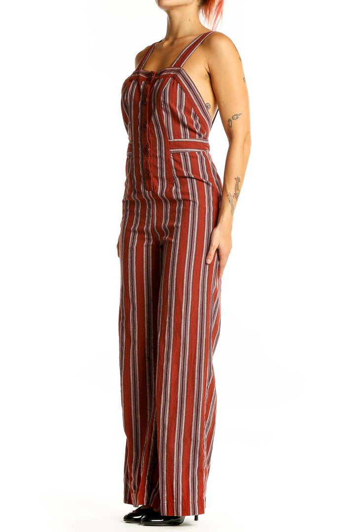 Front view of Audrey 3+1 rust striped linen-rayon jumpsuit with button-front design