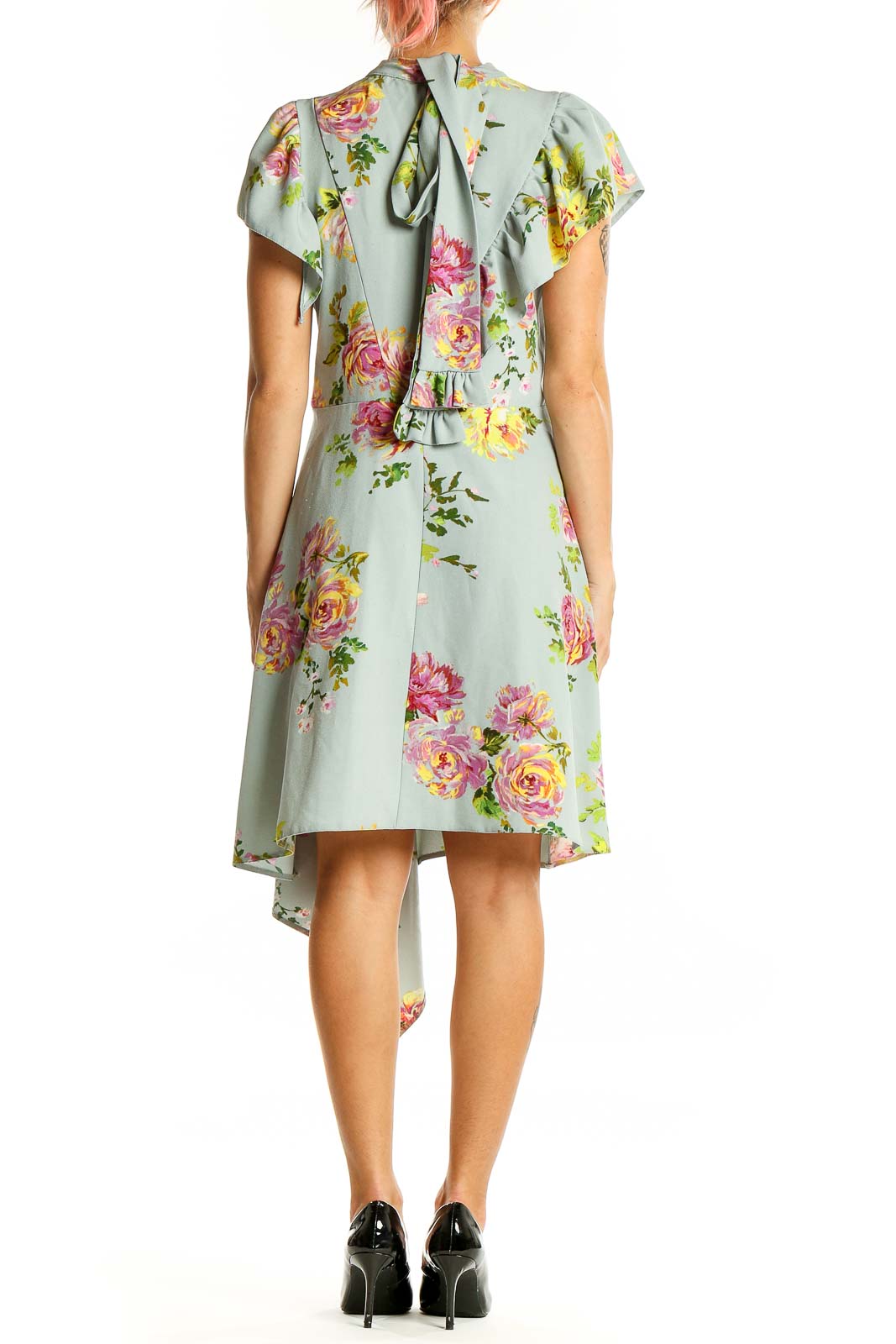 Back view of ASOS mint floral dress showing ruffled details and tie closure