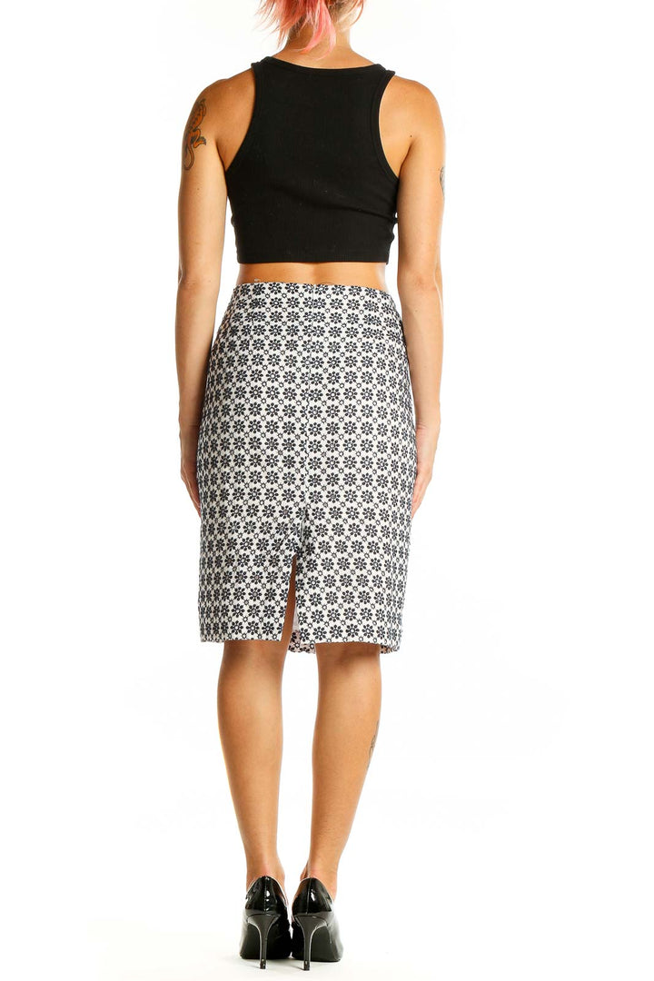 Back view of Ann Taylor black and white floral pencil skirt with slit