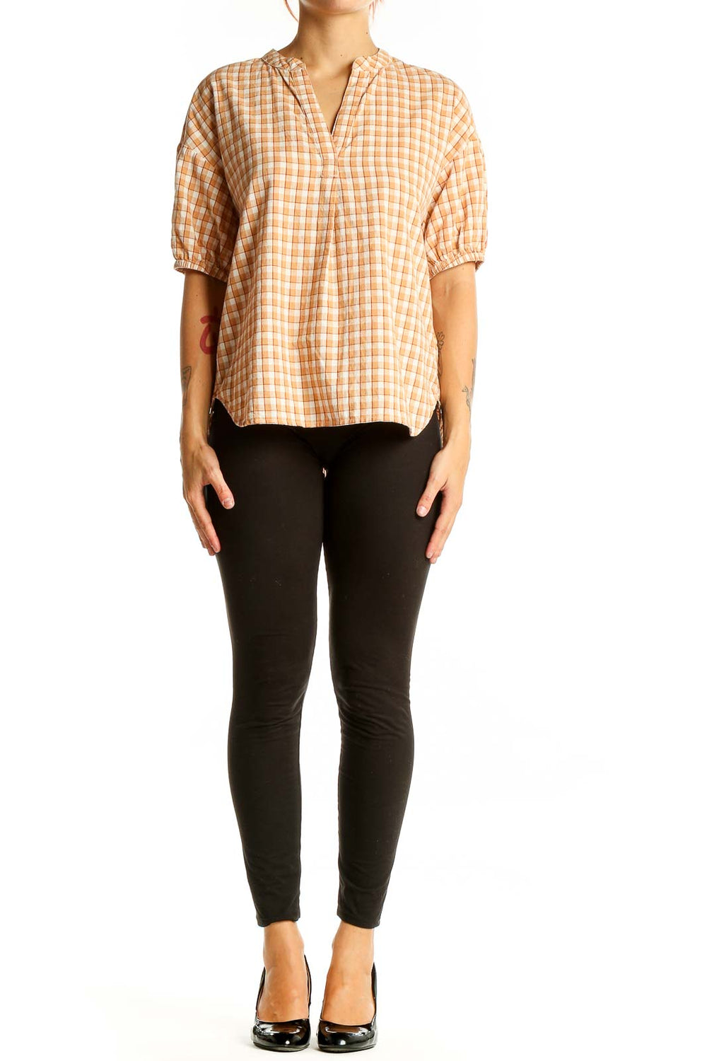 Front view of orange plaid Madewell cotton top with puff sleeves