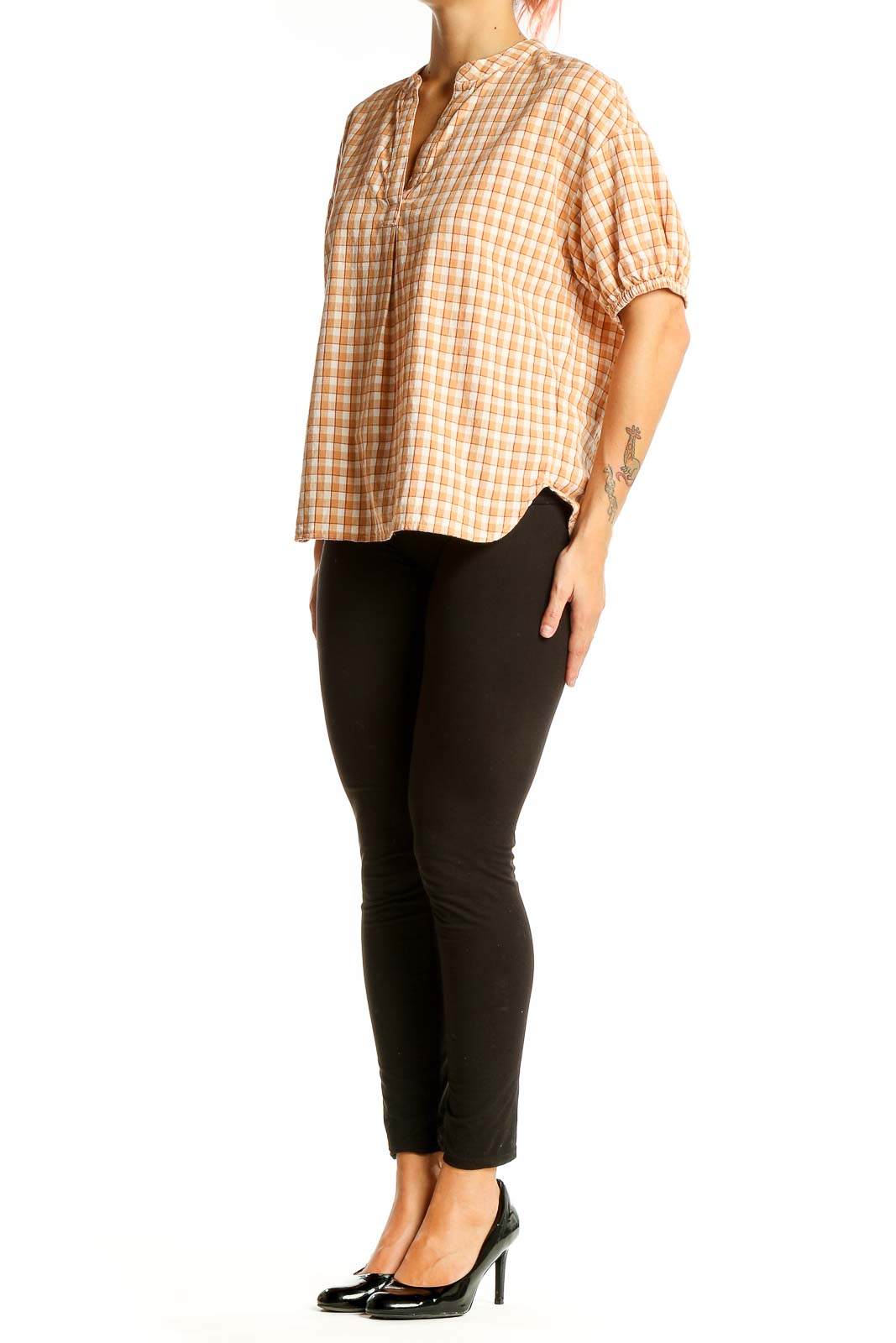 Front view of orange plaid Madewell cotton top with puff sleeves