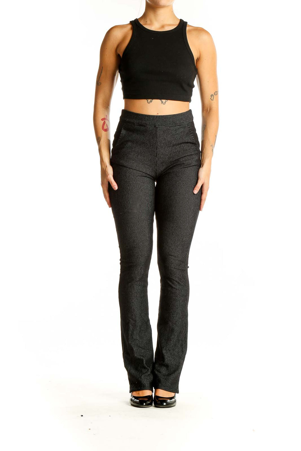 Front view of Studio M black ribbed flare pants on model