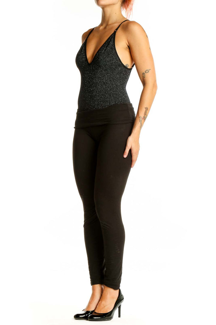 Front view of black sparkly plunge bodysuit with V-neckline