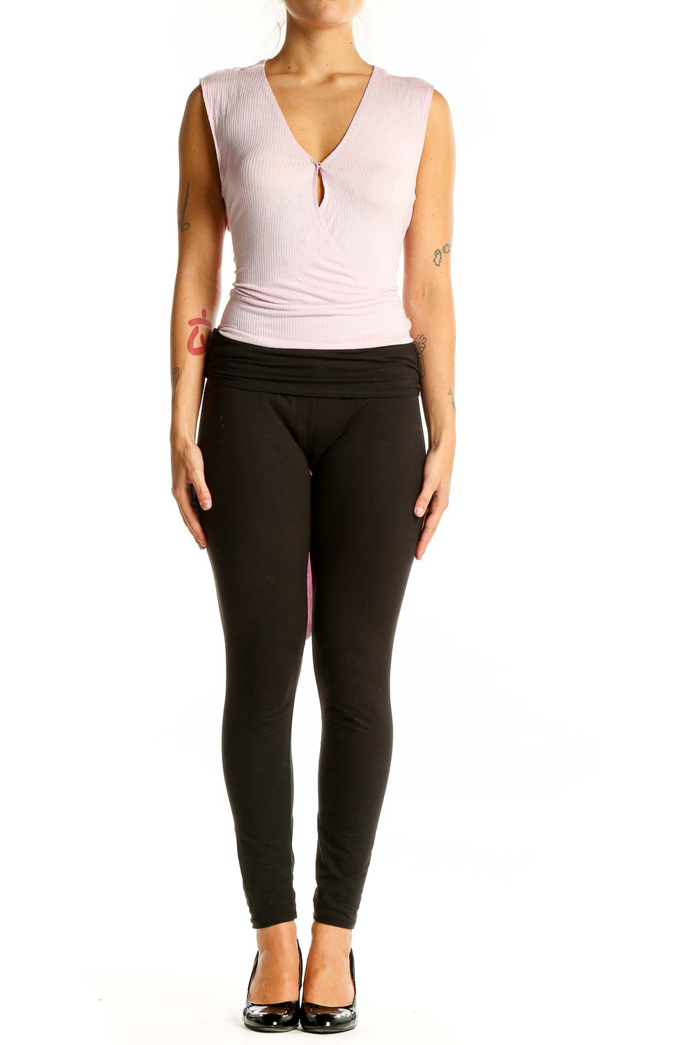 Front view of pink BCBGeneration sleeveless wrap-style top