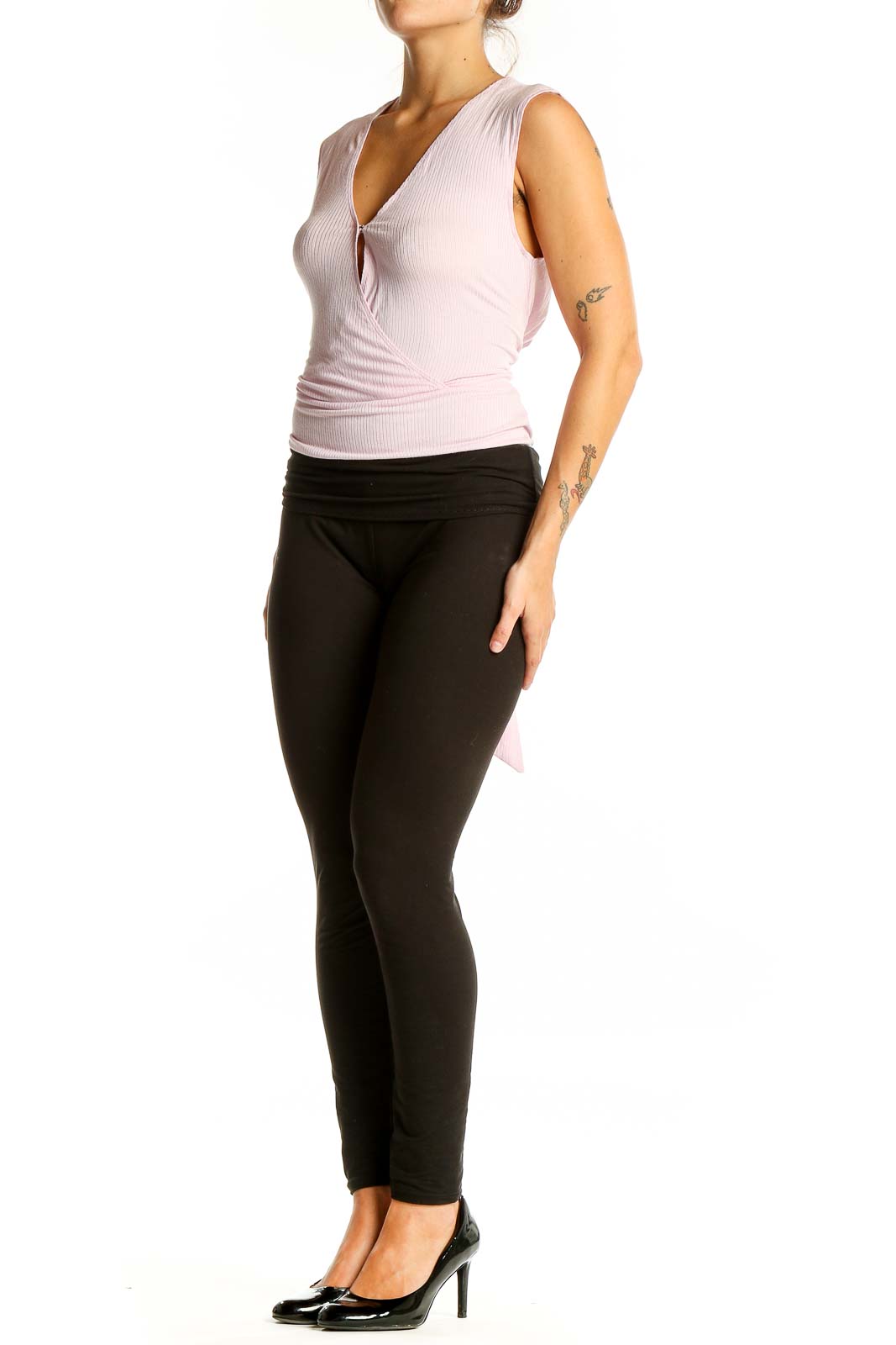 Front view of pink BCBGeneration sleeveless wrap-style top