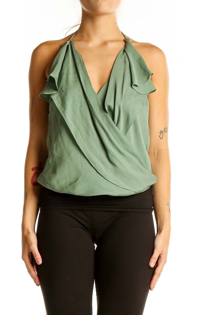 Front view of Haute Hippie sage green silk halter wrap top with ruffle details