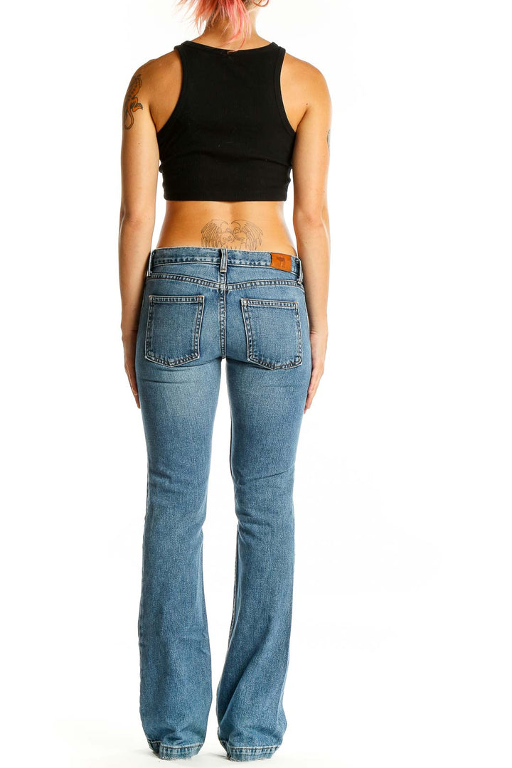 Back view of Earl Jeans blue flared denim jeans showing rear pockets and fit